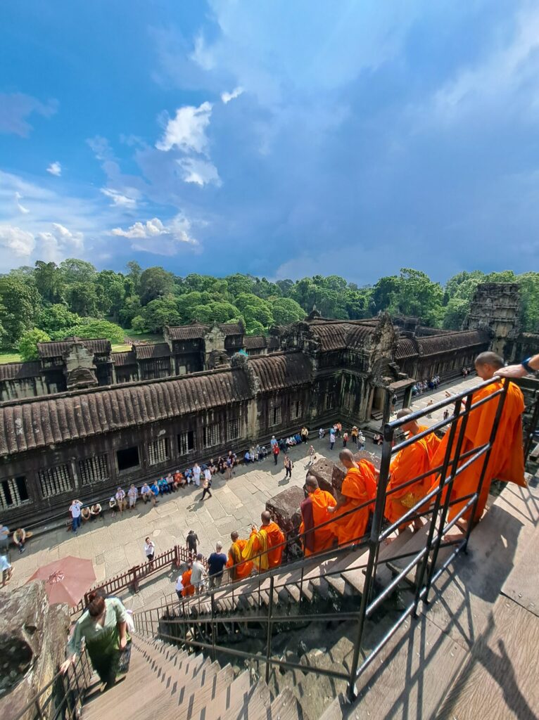 Buddhist Monks in Angkor Wat, Cambodia, during a daily ceremony
